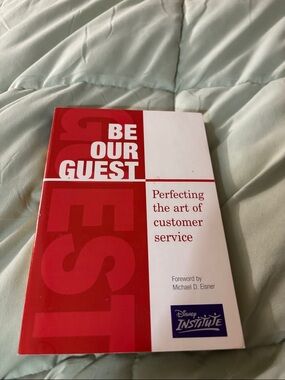 Disney Red and White "Be Our Guest" Customer Service Guide